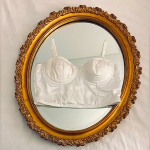 white corset top it’s adjustable in the back and has straps u can adjust aswell